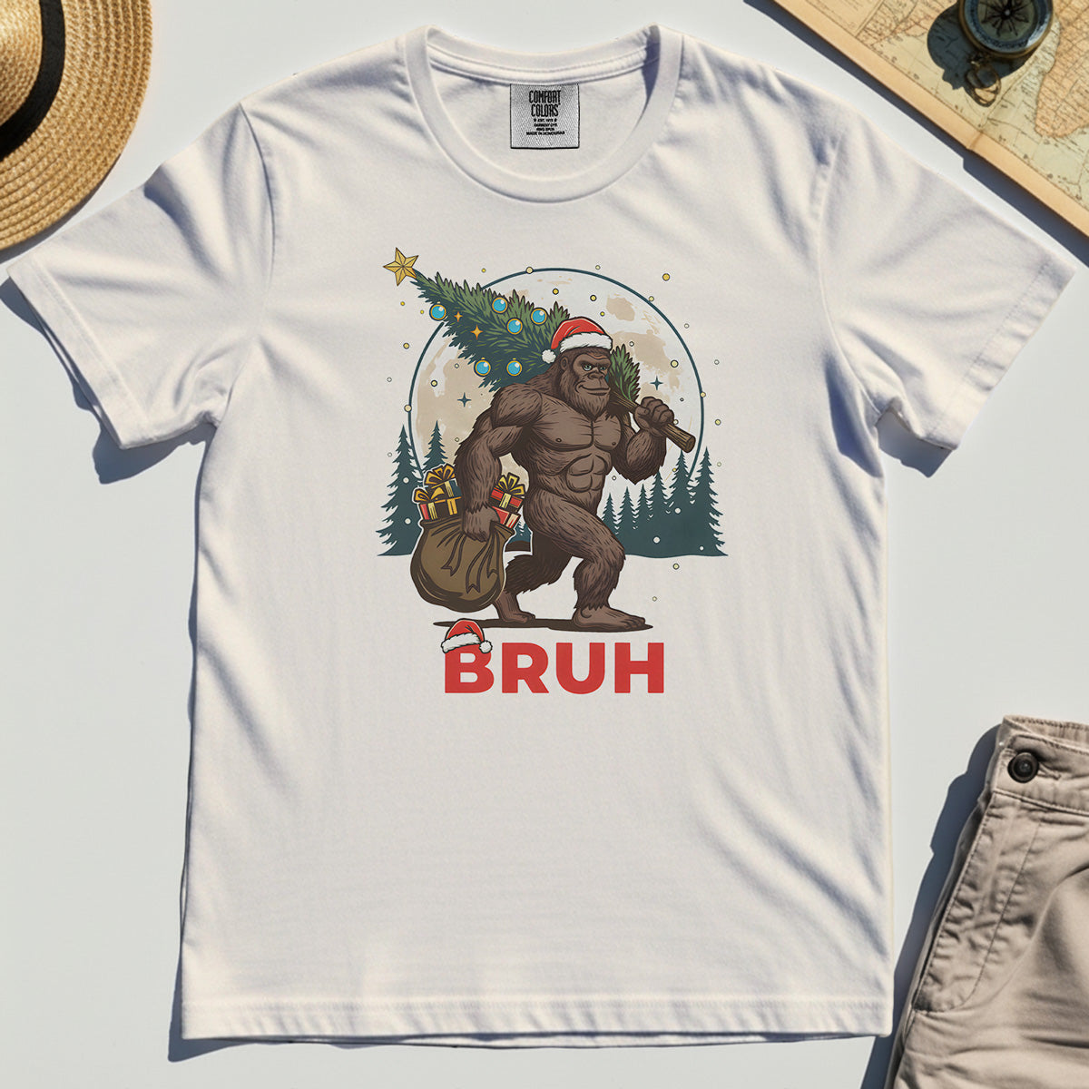 Bigfoot Christmas "BRUH" Comfort Tee, Retro Santa Hat Sasquatch Carrying Christmas Tree Comfort Color Tee 1